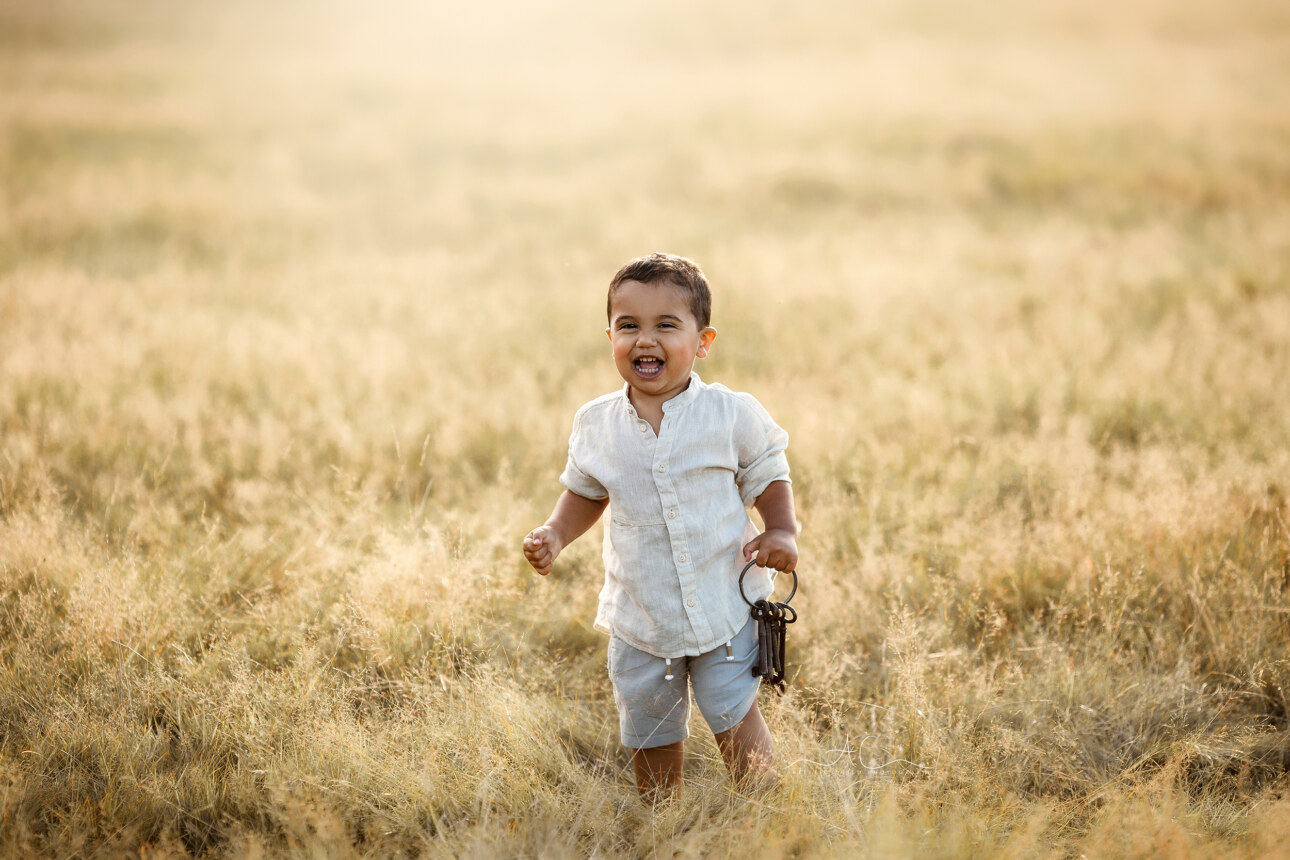 5 Magical South East London Toddler Boy Photos | little boy laughing in the meadow