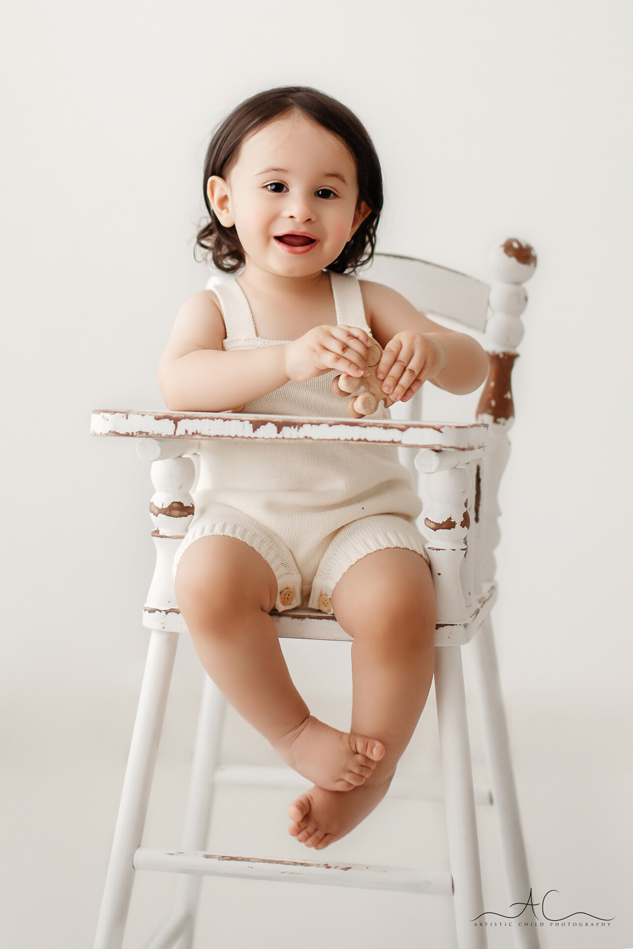 6 Stunning London Toddler Boy Pictures | Julian 4 Stunning London Toddler Boy Pictures | 18 months old boy sits in a white high chair during his professional photo session