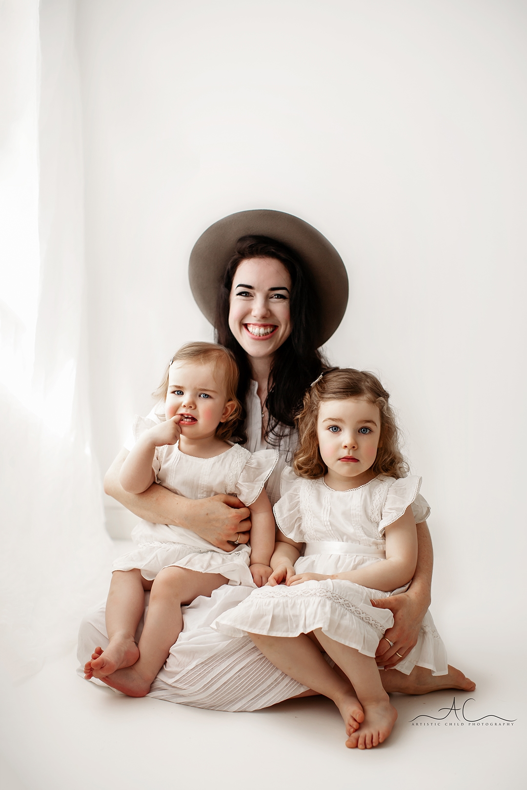 Beautiful London Mother's Day Mini Sessions | 2025 3 London Mother's Day Mini Sessions | a mum and her 2 toddler daughters