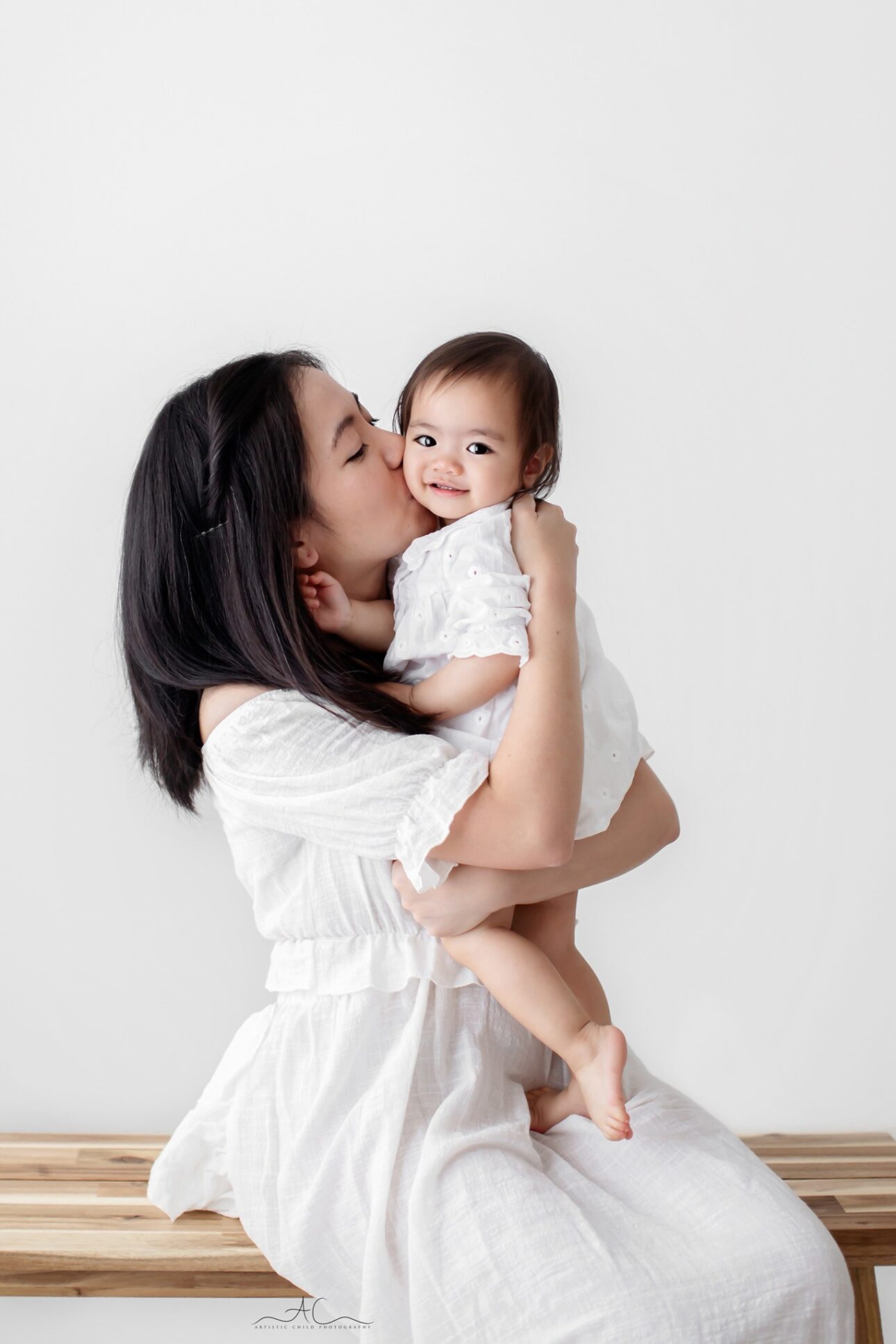 Beautiful London Mother's Day Mini Sessions | 2025 6 London Mother's Day Mini Sessions | A mum kissing her baby girl