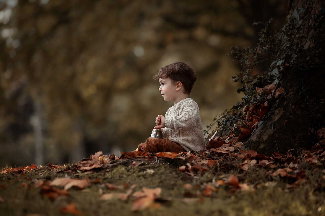 Stunning London Sibling Photo Session | Aurora & Dominic 3 Stunning London Sibling Photo Session | portrait of a 2 year old boy sitting under the trea in a local London park