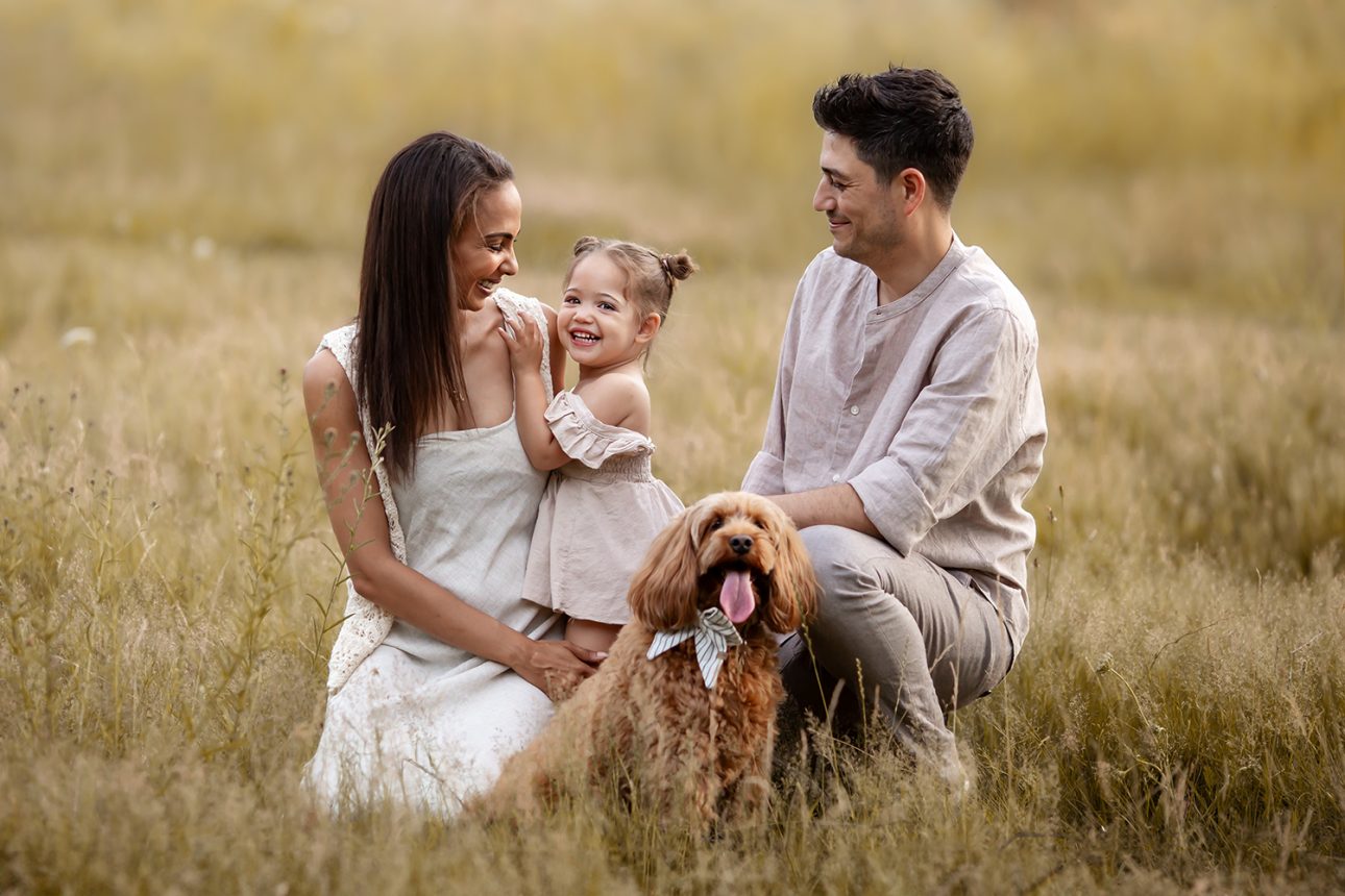 London Summer Family Minis | family of 3 +  a dog portrait taken in a grass field during a family photoshoot in South East London