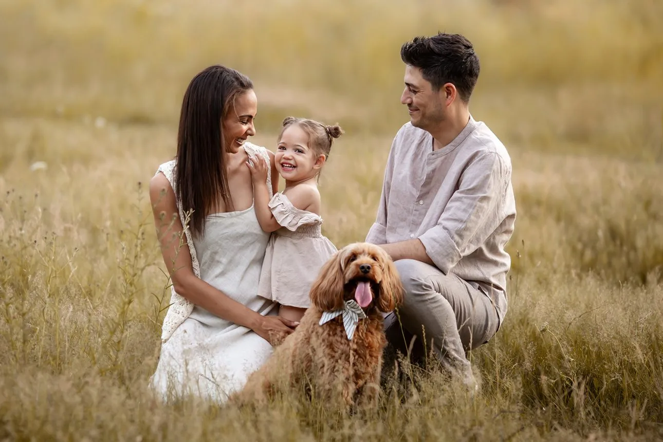 London Summer Family Minis | family of 3 +  a dog portrait taken in a grass field during a family photoshoot in South East London