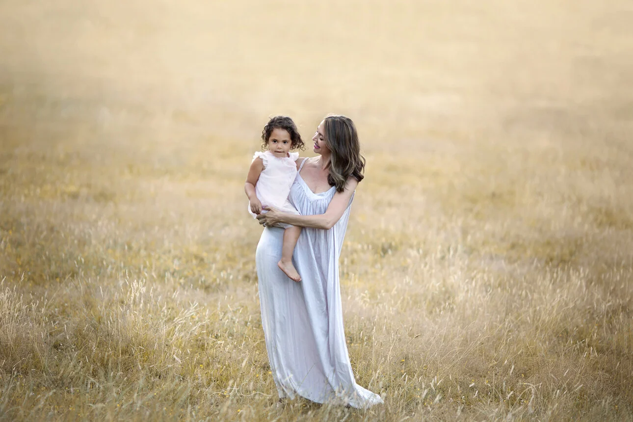 London Summer Sunset Family Mini Sessions | portrait of a mother holding her 3 years old daughter