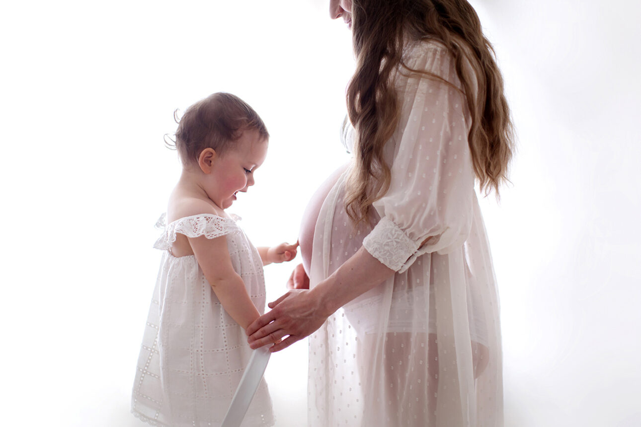 London Maternity Photography 10 London Maternity Photography | 2 year old girl pointing at her mum's pregnant belly