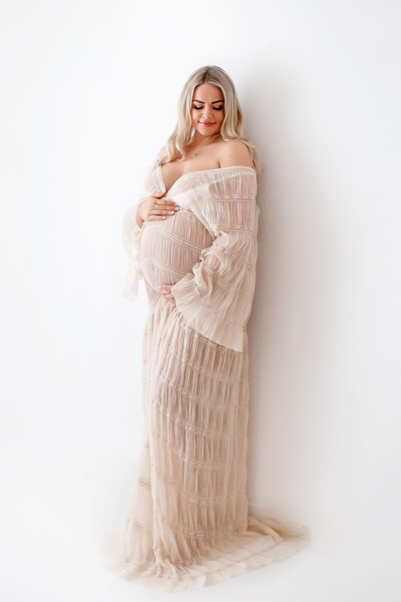 London Maternity Photography 4 London Maternity Photoshoot | pregnant woman wearing a long cream boho style dress