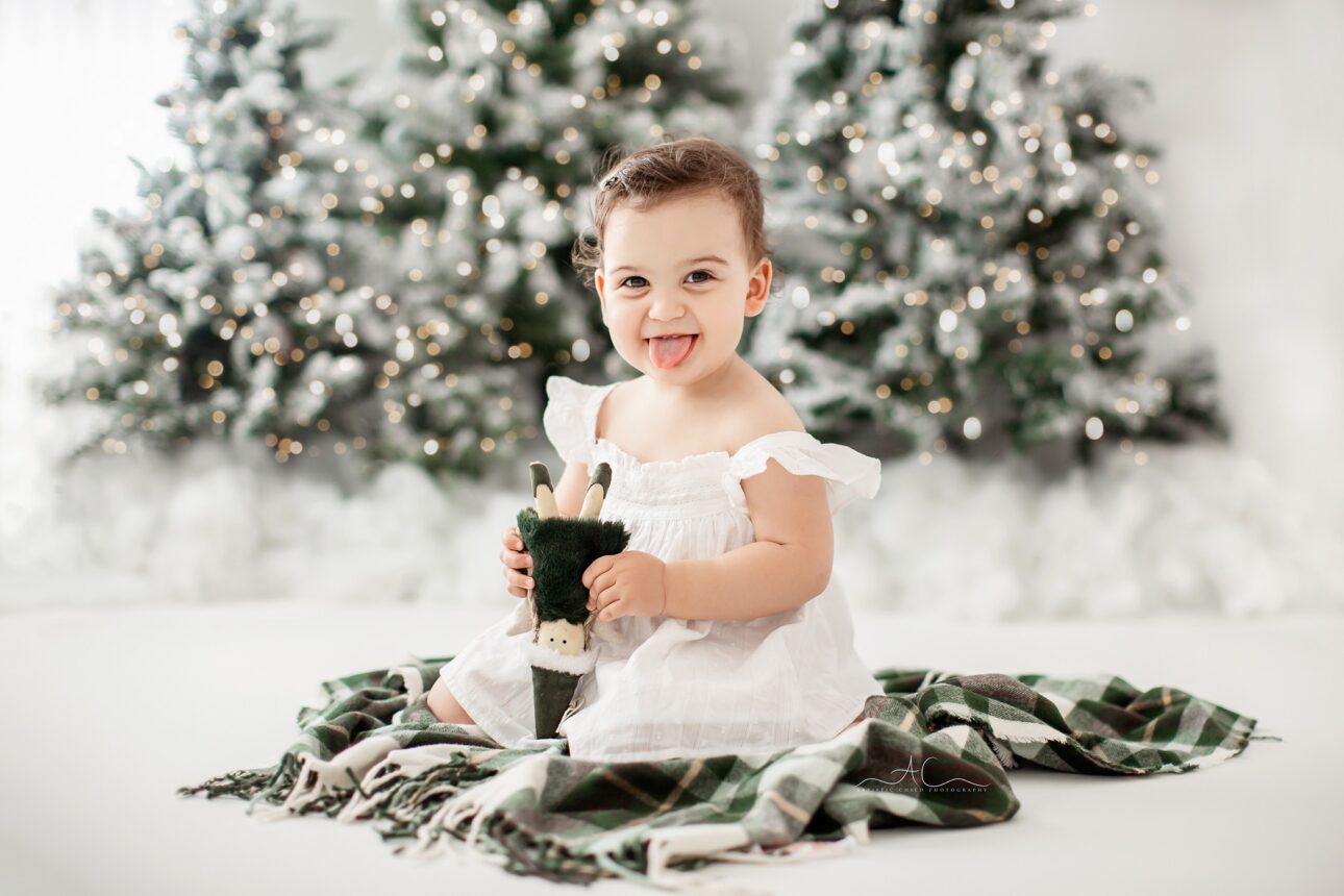 Baby Girl Xmas Portrait | cheeky Christmas Portrait of a 1 year old baby girl