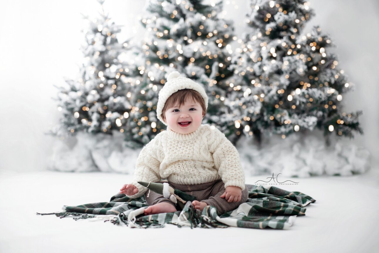 London Christmas Photoshoot | portrait of a baby boy on a Xmas blanket