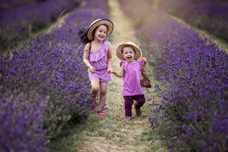 Sibling Photoshoot at London Lavender Field | sisters holding hands and running through the lavender field.