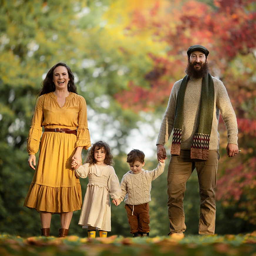 London Family Photographer | family of 4 walking together in London park