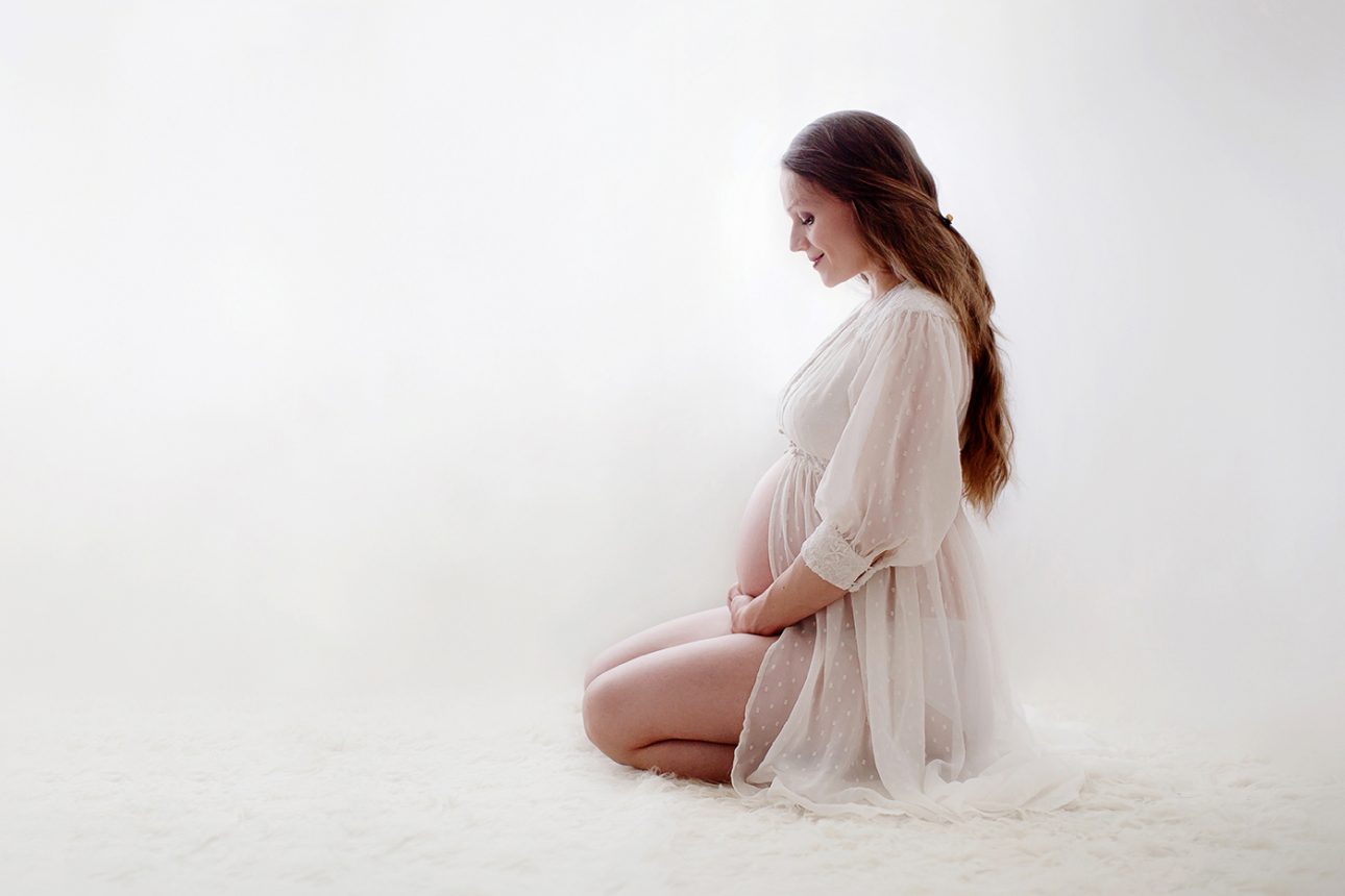 Bromley Maternity Photographer 17 Bromley Maternity Photoshoot | a profile portrait of an expecting mum looking at her bump