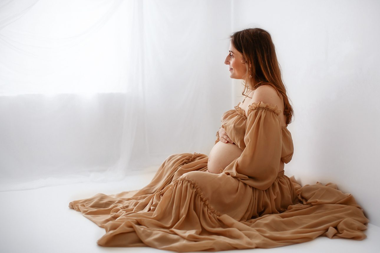 Bromley Maternity Photographer 42 Bromley Pregnancy Photo Session | mum to be wearing a stunning maternity 2 piece outfit