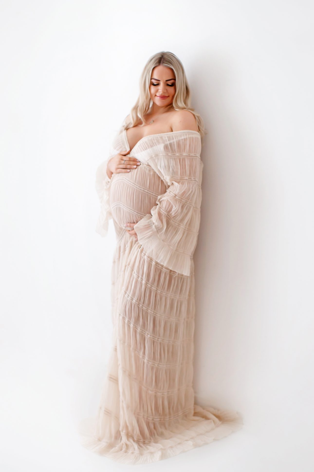 Bromley Maternity Photographer 25 Bromley Pregnancy Session | mum to be wearing a stunning maternity dress
